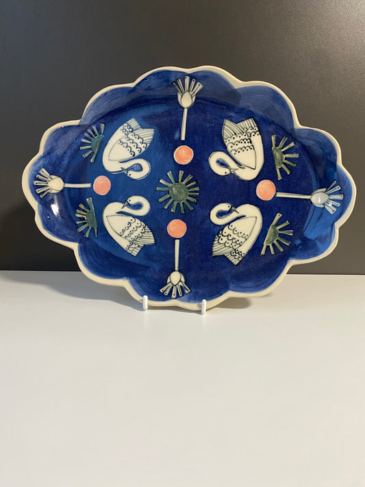 Ceramic Scallop Edge Platter with Swans Pattern against Blue Background