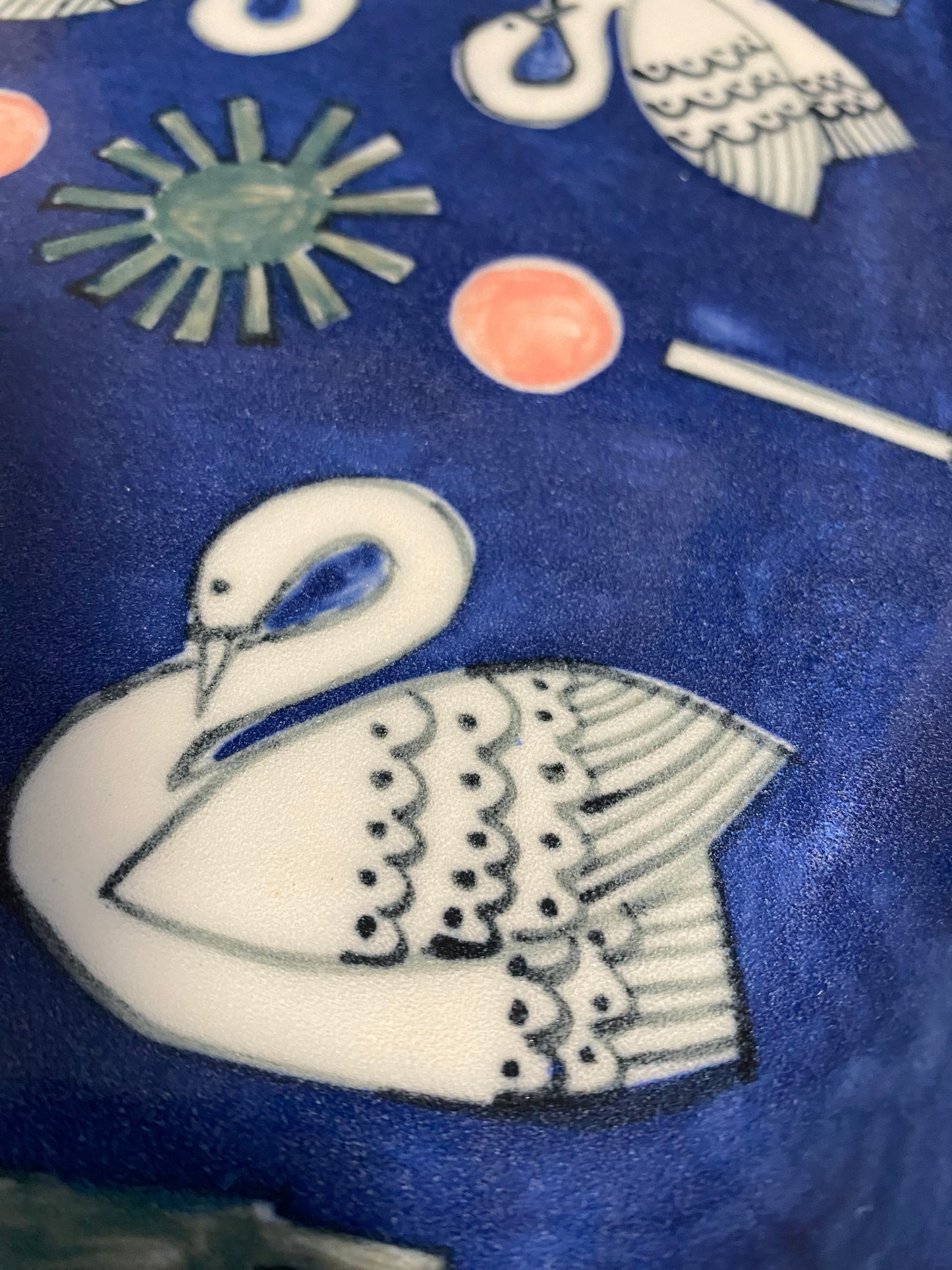 Ceramic Scallop Edge Platter with Swans Pattern against Blue Background